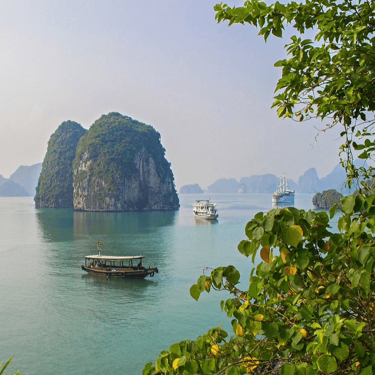 Vietnam bay landscape with limestone cliffs and boats