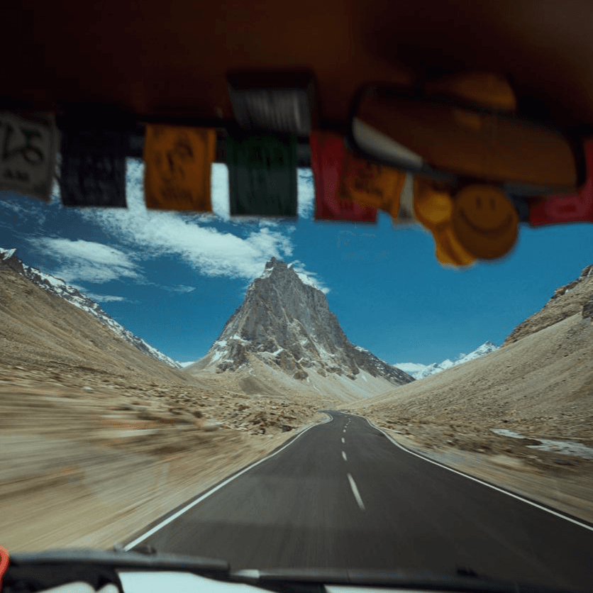 Zanskar Valley landscape with mountain walls and a reflective water edge